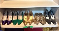 All five pairs lined on shelf