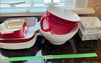 Group shot showing all eight pieces: stack of four bakers, batter bowl nested in mixing bowl, two berry baskets