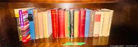 Full shelf showing all 16 books