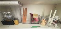 Shelf view showing all candles, vase, decor items together