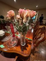 Overall view showing vases, decanter, plates on table