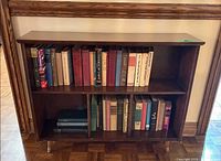 Front view showing full bookshelf and two shelves with divider