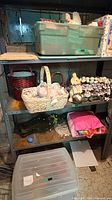 Full shelving unit showing totes, baskets, garland and gift bag