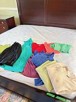Overview of garments spread on bed