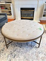 Full view of round ottoman coffee table in room