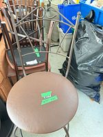 Front view of stool showing backrest design and seat