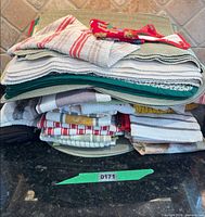Stack of towels and placemats showing quantity and variety