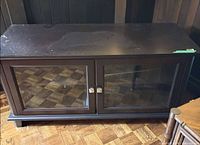 Front view of espresso media stand with glass doors