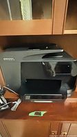 Front view of HP OfficeJet Pro 8710 printer with handset and cords