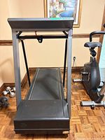 Full rear view of treadmill showing running belt and frame