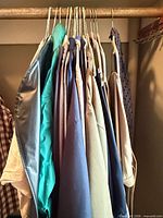 Row of assorted men’s shirts on hangers