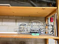 Full view of neon sign on shelf