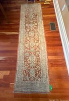 Full view of entire runner rug on hardwood floor