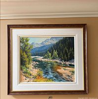 Full view of framed landscape painting