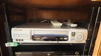Full view of Panasonic DMR-E30 combo unit with remote on top