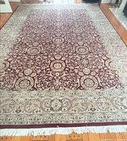 Full view of Persian rug showing entire pattern and fringe