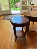Both round side tables together showing relative sizes
