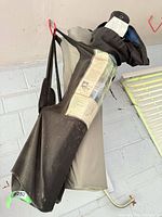 Two camping chairs in carry bags, black/grey and black/grey mix