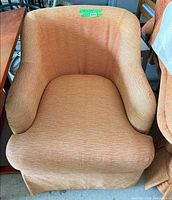 front view of one swivel chair showing overall design and upholstery