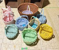 Group shot of all ten baskets arranged on floor