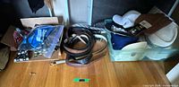 Belts, ties in bag, small accessory box, hats in bin