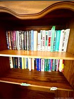 Upper shelf showing majority of book spines