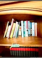 Top shelf showing assorted individual books, various genres