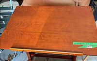Top surface showing wood grain and pencil ledge