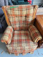 Full front view of plaid swivel armchair