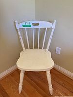 Full view of white wooden spindle-back chair