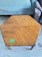 Top view showing hexagonal wood veneer pattern and metal corner caps