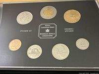 Front view of 1998 specimen set showing seven coins in holder