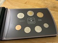 Front view showing all seven coins in specimen display with Royal Canadian Mint branding