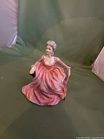 Front view of Coalport Polly figurine showing full gown