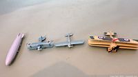 Group view of zeppelin and three biplanes lined side by side