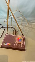 Full view of antenna showing telescoping ears, loop element and base with multicolor knob