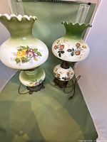 Pair of hurricane lamps showing overall design