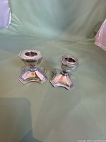 Pair of silver-plated candlestick holders, full view