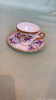 Teacup on saucer showing overall design and size