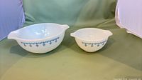 Both Pyrex bowls side by side showing size difference and exterior pattern