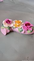Full view of Radnor bone china flower spray on grey surface