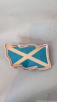 Front view showing Scottish Saltire blue and white enamel design with silver-tone border