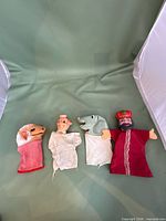 Group shot of four vinyl head hand puppets