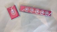 Pendant necklace and bracelet set in boxes