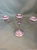 Full view of candelabra showing three arms and base