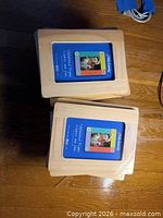 Two stacks of shrink-wrapped unfinished pine frames
