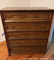 Front view showing five drawers without pulls