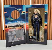 Open display box showing figure and accessories
