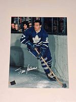 Full view of signed photo featuring Frank Mahovlich in action