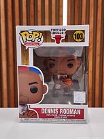 Front view of boxed Funko Pop! Dennis Rodman figure showing character and branding
